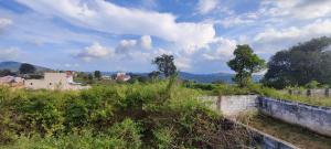 a view of a field with trees and buildings at MURALI VILLAS in Yelagiri