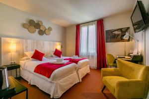 Postel nebo postele na pokoji v ubytování Le Central Boutique Hôtel