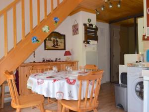 a dining room with a table and a staircase at Appartement Bernex, 2 pièces, 6 personnes - FR-1-498-31 in Bernex