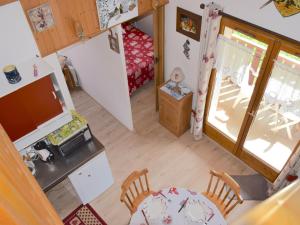 an overhead view of a kitchen and dining room in a doll house at Appartement Bernex, 2 pièces, 6 personnes - FR-1-498-31 in Bernex