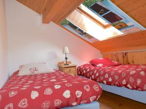 a bedroom with two beds in a attic at Appartement Bernex, 2 pièces, 6 personnes - FR-1-498-31 in Bernex