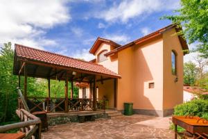 a patio with a pavilion in front of a house at Dilijan Dream House! 3 Bedroom Amazing Villa in National Park! in Dilijan