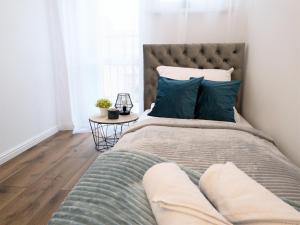 Posteľ alebo postele v izbe v ubytovaní Apartament Skandynawski