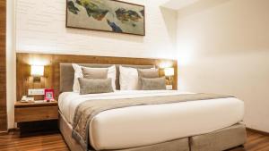 Postel nebo postele na pokoji v ubytování Hotel Centre Point