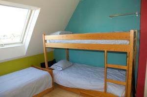 En eller flere senge i et værelse på La terrasse du grand bleu à Wimereux