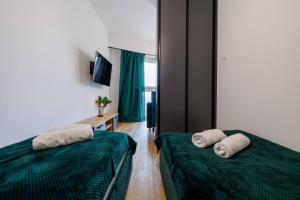 Posteľ alebo postele v izbe v ubytovaní Panorama Capital Lily - 19 piętro