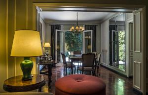 a living room with a table and a dining room at Bed And Breakfast Plaza Italia in Mendoza