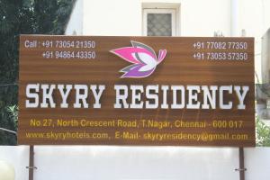a sign for a city registry in front of a building at Skyry Residency in Chennai
