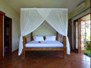 Кровать или кровати в номере Villa Kawan