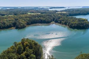 an island in the middle of a lake at Waterfront, Luxury, Spacious home in Freeport! in Freeport