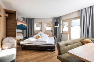 Ένα ή περισσότερα κρεβάτια σε δωμάτιο στο Apartments Dorfbäck +41 φωτογραφίες