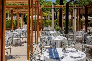 a set up for a wedding reception with white tables and chairs at Hotel Park Split in Split