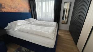 Posteľ alebo postele v izbe v ubytovaní The Gatsby Apartment