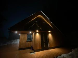 a small building with lights on top of it at Brunarica Rogla in Vitanje