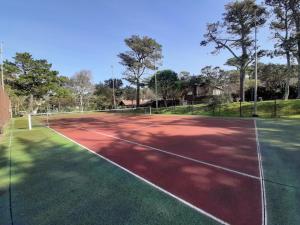 a tennis court with a net on it at Maison Seignosse, 3 pièces, 4 personnes - FR-1-239-385 in Seignosse