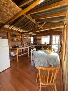 a kitchen and dining room with a table and a refrigerator at Los Conejos in Santa Cruz de Tenerife +29 photos