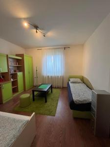 a room with two beds and a table in it at Kares house in Belgrade +17 photos