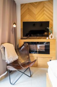 Televízia a/alebo spoločenská miestnosť v ubytovaní Apartament Wielka Turnia by Apart Concept Podhale