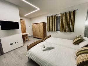 Postel nebo postele na pokoji v ubytování B&B L'Aigual