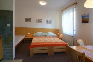 Posteľ alebo postele v izbe v ubytovaní Apartman 300