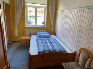 Postel nebo postele na pokoji v ubytování Berggarten Schwalenberg