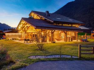 a large wooden house with a gambrel roof at Chalet Morzine, 6 pièces, 13 personnes - FR-1-627-8 in Morzine