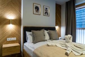 Apartament Tarasowa Polana by Apart Concept Podhale tesisinde bir odada yatak veya yataklar