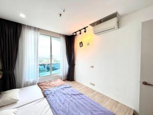 Letto o letti in una camera di Concept Suite 05 @ The Wave Residence