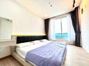 Letto o letti in una camera di Concept Suite 05 @ The Wave Residence