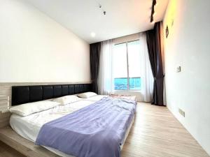 Letto o letti in una camera di Concept Suite 05 @ The Wave Residence