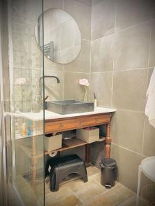 a bathroom with a sink and a mirror at Le Capitole in Toulouse