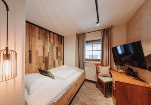 Ein Bett oder Betten in einem Zimmer der Unterkunft Hotel LÜ - Adults Only