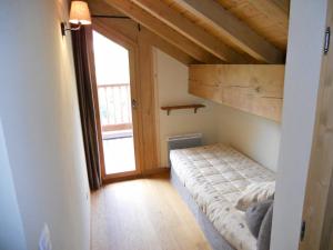 a bedroom with a bunk bed and a large window at Appartement Valloire, 4 pièces, 8 personnes - FR-1-263-199 in Valloire