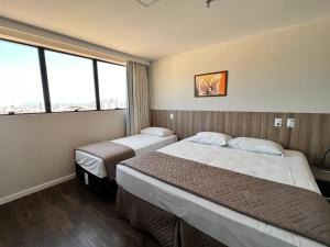Hotel 7 Itajaí房間的床