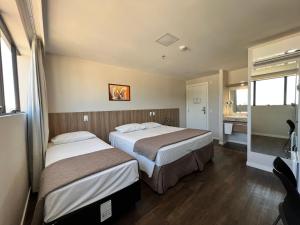 Hotel 7 Itajaí房間的床