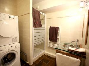 a bathroom with a washing machine and a sink at Appartement Valloire, 4 pièces, 8 personnes - FR-1-263-209 in Valloire