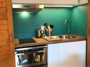 a kitchen with a sink and a counter top at Appartement Valloire, 2 pièces, 6 personnes - FR-1-263-408 in Valloire