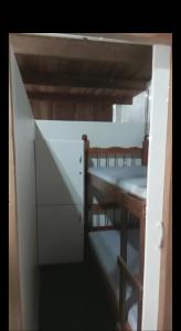 a small room with a bunk bed and a desk at Trip Adventure Poa in Porto Alegre