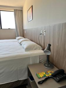 Hotel 7 Itajaí房間的床