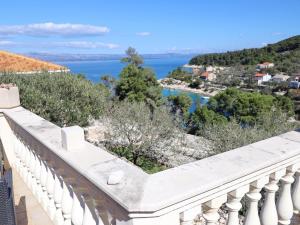 a balcony with a view of the water at Stone House Horizont in Vela Luka