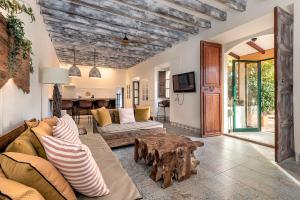 a living room with a couch and a table at Villa Nice Mallorca in Palma de Mallorca