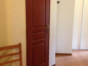 a wooden door in a room with a wooden floor at Appartement Valloire, 2 pièces, 4 personnes - FR-1-263-472 in Valloire