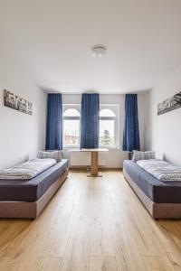 Een bed of bedden in een kamer bij Moderne Monteurwohnung in Leipzig Nord