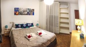 a bedroom with a large bed with two pillows at Capodimonte 39A in Ancona