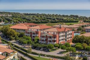 an aerial view of a apartment complex with a parking lot at Pini Village Lido Altanea in Caorle