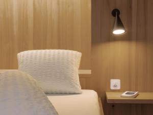 Postel nebo postele na pokoji v ubytování Hotel Alpina