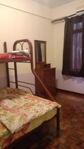 Uma ou mais camas em beliche em um quarto em D'Mentari - Cozy 3 Rooms Apartment