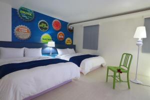 Postel nebo postele na pokoji v ubytování Guo Chen Hotel