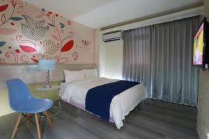 Ένα ή περισσότερα κρεβάτια σε δωμάτιο στο Guo Chen Hotel