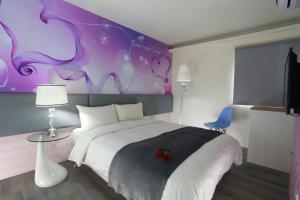 Postel nebo postele na pokoji v ubytování Guo Chen Hotel